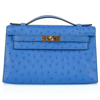 Vivid Cornflower Blue Tiny Raised Dot Slim Flat Rectangular Hand Clutch With Luminous Golden Twist Lock Hardware And Single Thin Curved Top Grip
