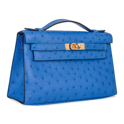 Vivid Cornflower Blue Tiny Raised Dot Slim Flat Rectangular Hand Clutch With Luminous Golden Twist Lock Hardware And Single Thin Curved Top Grip