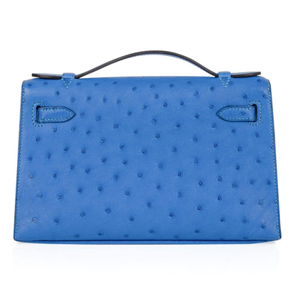 Vivid Cornflower Blue Tiny Raised Dot Slim Flat Rectangular Hand Clutch With Luminous Golden Twist Lock Hardware And Single Thin Curved Top Grip